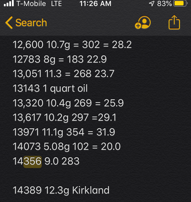 whiteboard with messy columns of data